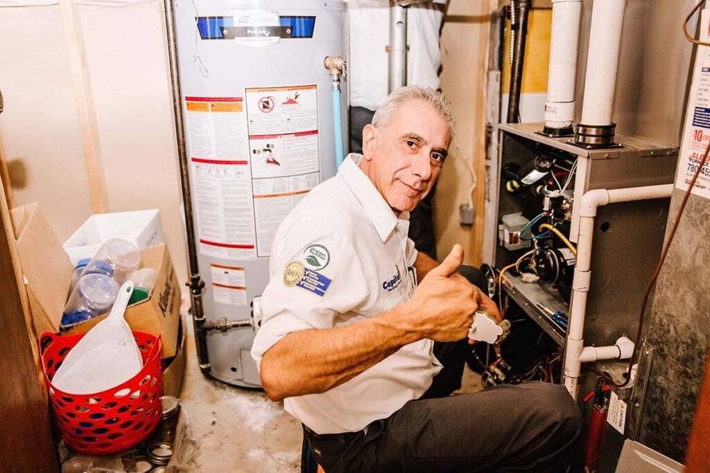 Repairman fixing boiler